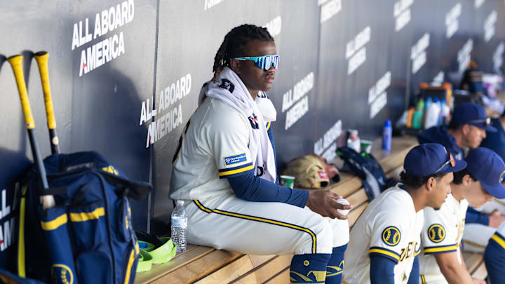 Feb 27, 2026; Phoenix, Arizona, USA; Milwaukee Brewers infielder Jesus Made sits in the dugout against the Chicago White Sox during a spring training game at American Family Fields of Phoenix. Mandatory Credit: Mark J. Rebilas-Imagn Images