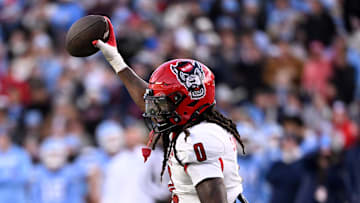 Nov 30, 2024; Chapel Hill, North Carolina, USA; North Carolina State Wolfpack linebacker Sean Brown (0) reacts after recovering a fumble in the first quarter at Kenan Memorial Stadium. Mandatory Credit: Bob Donnan-Imagn Images