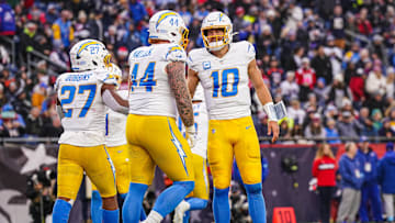 Dec 28, 2024; Foxborough, Massachusetts, USA; Los Angeles Chargers quarterback Justin Herbert (10) reacts after running back J.K. Dobbins (27) scores against the New England Patriots in the second half at Gillette Stadium. Mandatory Credit: David Butler II-Imagn Images