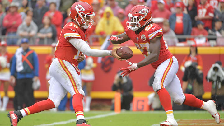 Oct 7, 2018; Kansas City, MO, USA; Kansas City Chiefs quarterback Patrick Mahomes (15) hands off to running back Kareem Hunt (27) during the game against the Jacksonville Jaguars at Arrowhead Stadium. Mandatory Credit: Denny Medley-Imagn Images