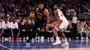 Nov 14, 2025; New York, New York, USA; New York Knicks center Karl-Anthony Towns (32) drives to the basket against Miami Heat forward Andrew Wiggins (22) during the second quarter at Madison Square Garden. Mandatory Credit: Brad Penner-Imagn Images