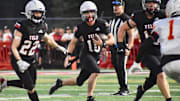 New starting Yelm quarterback Parker Myers scrambles in 2024 opener against Mount Tahoma