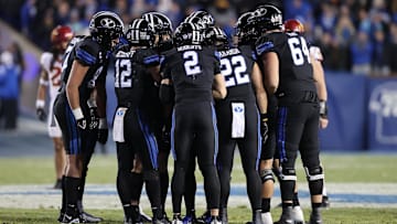 Nov 11, 2023; Provo, Utah, USA; The Brigham Young Cougars huddle up before a play against the Iowa State Cyclones in the second half at LaVell Edwards Stadium. Mandatory Credit: Rob Gray-Imagn Images