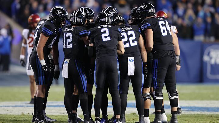Nov 11, 2023; Provo, Utah, USA; The Brigham Young Cougars huddle up before a play against the Iowa State Cyclones in the second half at LaVell Edwards Stadium. Mandatory Credit: Rob Gray-Imagn Images