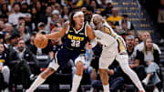 Oct 29, 2025; Denver, Colorado, USA; Denver Nuggets forward Aaron Gordon (32) controls the ball under pressure from New Orleans Pelicans guard Saddiq Bey (41) in the first quarter at Ball Arena. Mandatory Credit: Isaiah J. Downing-Imagn Images