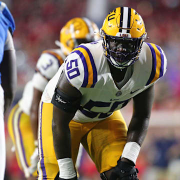 Sep 30, 2023; Oxford, Mississippi, USA; LSU Tigers offensive linemen Emery Jones Jr. (50) lines up prior to the snap during the second half against the Mississippi Rebels at Vaught-Hemingway Stadium. Mandatory Credit: Petre Thomas-Imagn Images