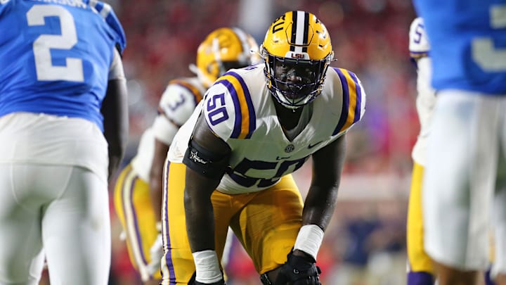 Sep 30, 2023; Oxford, Mississippi, USA; LSU Tigers offensive linemen Emery Jones Jr. (50) lines up prior to the snap during the second half against the Mississippi Rebels at Vaught-Hemingway Stadium. Mandatory Credit: Petre Thomas-Imagn Images