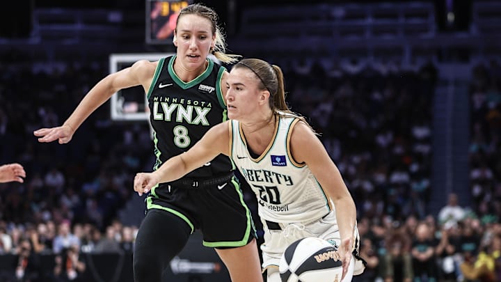 Jun 25, 2024; Belmont Park, New York, USA; New York Liberty guard Sabrina Ionescu (20) dribbles past Minnesota Lynx forward Alanna Smith (8) Jun 25, 2024; Belmont Park, New York, USA; New York Liberty guard Sabrina Ionescu (20) dribbles past Minnesota Lynx forward Alanna Smith (8)