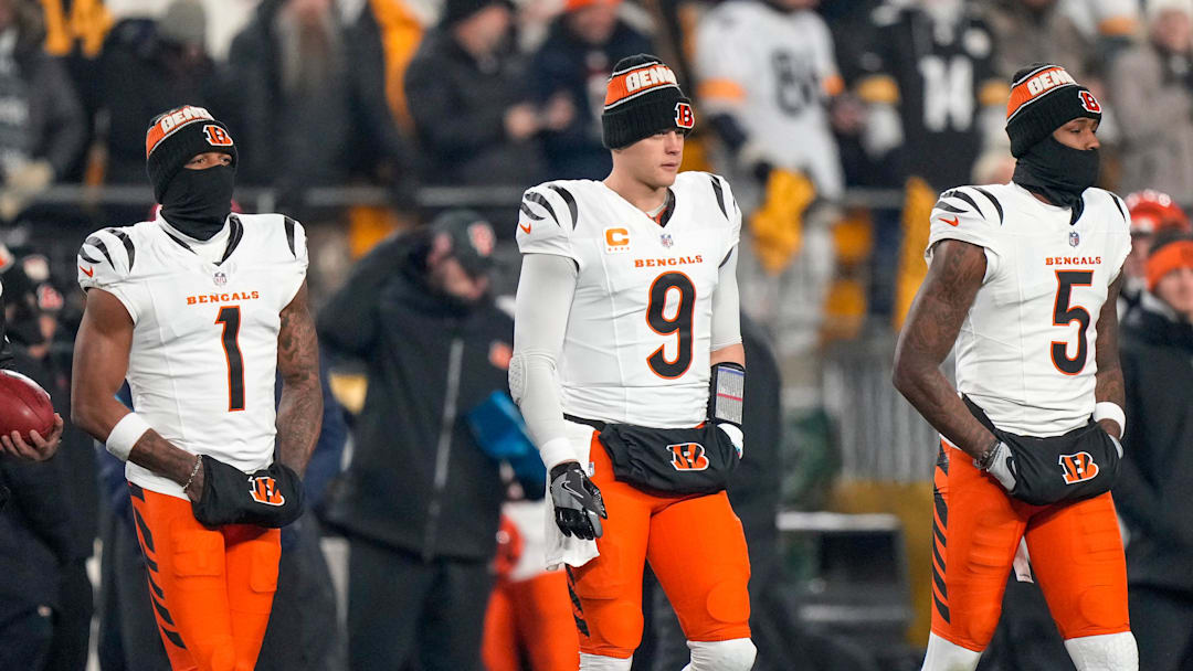 Cincinnati Bengals wide receiver Ja'Marr Chase (1), quarterback Joe Burrow (9) and wide receiver Tee Higgins (5) take the field as captains for the coin toss before the first quarter of the NFL Week 18 game between the Pittsburgh Steelers and the Cincinnati Bengals at Acrisure Stadium in Pittsburgh on Saturday, Jan. 4, 2025.