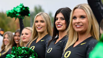 Oct 11, 2025; Eugene, Oregon, USA; Oregon Ducks cheerleaders greet their team as they arrive before the game against the Indiana Hoosiers at Autzen Stadium. Mandatory Credit: Troy Wayrynen-Imagn Images