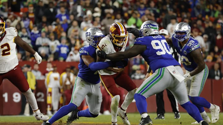 Jayden Daniels suffered an arm injury in Washington's loss to the Seahawks.