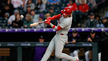 May 20, 2025; Denver, Colorado, USA; Philadelphia Phillies second baseman Bryson Stott (5) hits a single in the sixth inning against the Colorado Rockies at Coors Field. 