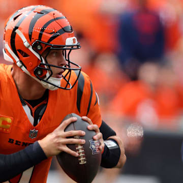 Sep 8, 2024; Cincinnati, Ohio, USA;  Cincinnati Bengals quarterback Joe Burrow (9) runs the ball during the first quarter against the New England Patriots at Paycor Stadium. Mandatory Credit: Joseph Maiorana-Imagn Images