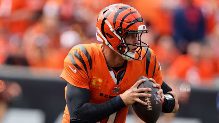 Sep 8, 2024; Cincinnati, Ohio, USA;  Cincinnati Bengals quarterback Joe Burrow (9) runs the ball during the first quarter against the New England Patriots at Paycor Stadium. Mandatory Credit: Joseph Maiorana-Imagn Images