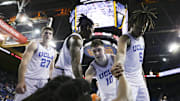 Mar 7, 2024; Los Angeles, California, USA; Members of the UCLA mens basketball team assist UCLA guard Sebastian Mack (12) during the second half of a game against the Arizona Wildcats at Pauley Pavilion presented by Wescom. Mandatory Credit: Yannick Peterhans-Imagn Images
