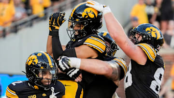 Iowa Hawkeyes wide receiver Seth Anderson (6) is lifted into the air as teammates celebrate his touchdown with him during a football game against the Massachusetts Minutemen Sept. 13, 2025 at Kinnick Stadium in Iowa City, Iowa.