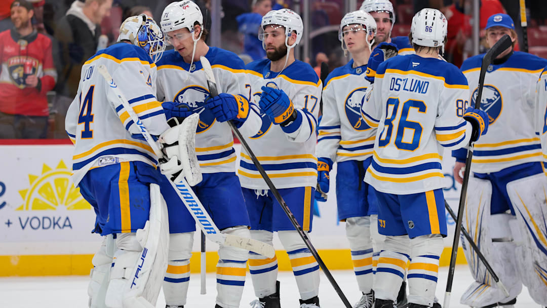 Feb 2, 2026; Sunrise, Florida, USA; Buffalo Sabres center Ryan McLeod (71) celebrates with goaltender Alex Lyon (34) after the game against the Florida Panthers at Amerant Bank Arena. Mandatory Credit: Sam Navarro-Imagn Images
