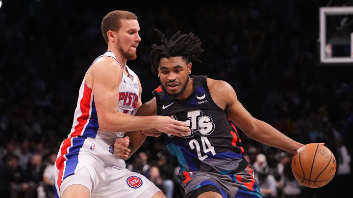 Apr 6, 2024; Brooklyn, New York, USA; Brooklyn Nets shooting guard Cam Thomas (24) drives the ball against Detroit Pistons point guard Malachi Flynn (14) during the second half at Barclays Center. Mandatory Credit: Gregory Fisher-USA TODAY Sports