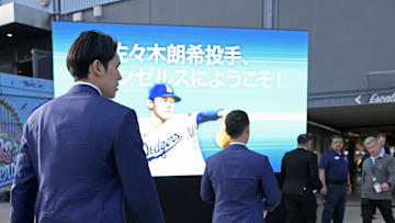 Jan 22, 2025; Los Angeles, CA, USA;  Los Angeles Dodgers pitcher Roki Sasaki (11) arrives for an introductory press conference at Dodger Stadium. 