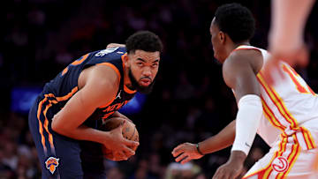 Dec 11, 2024; New York, New York, USA; New York Knicks center Karl-Anthony Towns (32) controls the ball against Atlanta Hawks forward Onyeka Okongwu (17) during the third quarter at Madison Square Garden. Mandatory Credit: Brad Penner-Imagn Images