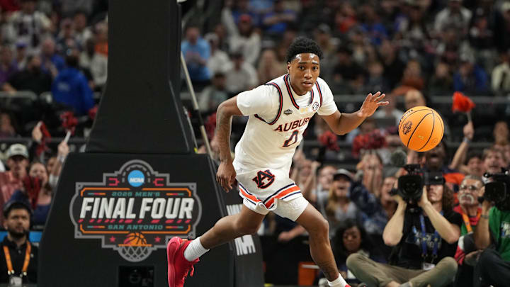 Apr 5, 2025; San Antonio, TX, USA; Auburn Tigers guard Tahaad Pettiford (0) drives to the basket against the Florida Gators during the first half in the semifinals of the men's Final Four of the 2025 NCAA Tournament at the Alamodome. Mandatory Credit: Bob Donnan-Imagn Images