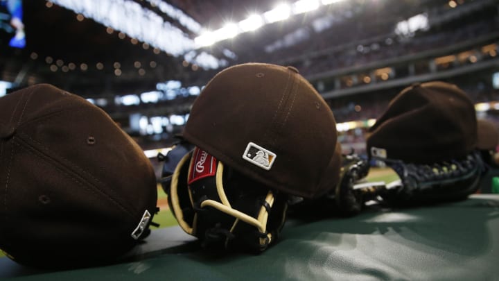 Apr 11, 2021; Arlington, Texas, USA; A general view of gloves and hats during the game between the San Diego Padres and the Texas Rangers at Globe Life Field. Mandatory Credit: Tim Heitman-USA TODAY Sports