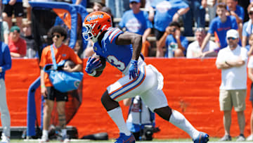 Apr 12, 2025; Gainesville, FL, USA; Florida Gators running back Jadan Baugh (13) rushes with the ball during the first half at Ben Hill Griffin Stadium. Mandatory Credit: Matt Pendleton-Imagn Images