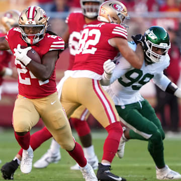 Sep 9, 2024; Santa Clara, California, USA; San Francisco 49ers running back Jordan Mason (24) carries the ball against the New York Jets during the first quarter at Levi's Stadium. Mandatory Credit: Darren Yamashita-Imagn Images