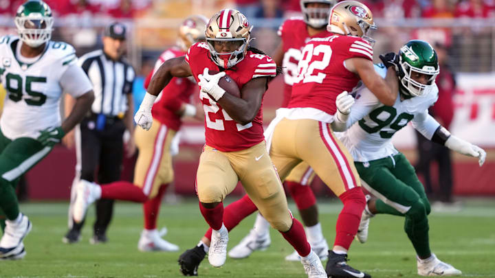 Sep 9, 2024; Santa Clara, California, USA; San Francisco 49ers running back Jordan Mason (24) carries the ball against the New York Jets during the first quarter at Levi's Stadium. Mandatory Credit: Darren Yamashita-Imagn Images