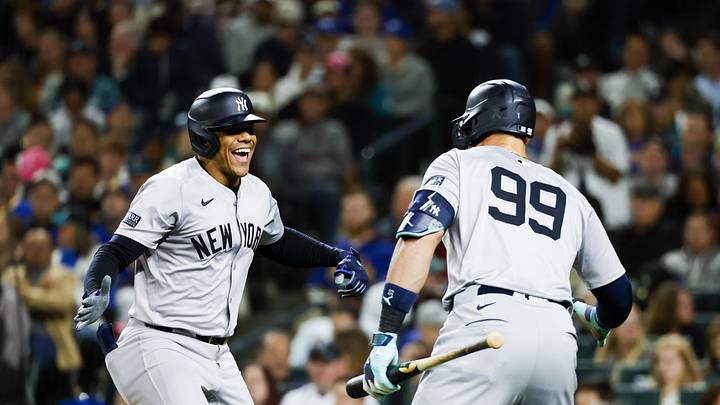 Sep 17, 2024; Seattle, Washington, USA; New York Yankees right fielder Juan Soto (22) celebrates a two-run home run against the Seattle Mariners with designated hitter Aaron Judge (99) during the fourth inning at T-Mobile Park. Mandatory Credit: Joe Nicholson-Imagn Images