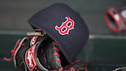 May 14, 2014; Minneapolis, MN, USA; A general view of a glove and Boston Red Sox hat in the dugout prior to a game between the Boston Red Sox and Minnesota Twins at Target Field. Mandatory Credit: Jesse Johnson-Imagn Images