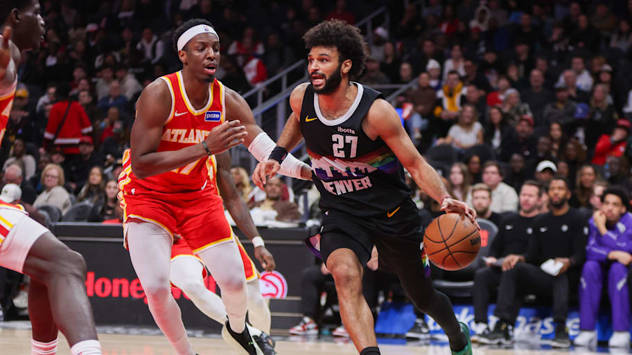 Nuggets guard Jamal Murray drives on Hawks forward Onyeka Okongwu.