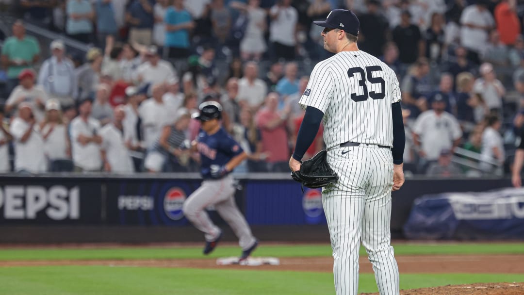 Jul 5, 2024; Bronx, New York, USA; New York Yankees relief pitcher Clay Holmes (35) look up as as Boston Red Sox left fielder Masataka Yoshida (7) rounds third base after his three run home run during the ninth inning at Yankee Stadium. Mandatory Credit: Vincent Carchietta-USA TODAY Sports