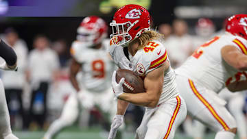 Sep 22, 2024; Atlanta, Georgia, USA; Kansas City Chiefs running back Carson Steele (42) runs the ball against the Atlanta Falcons in the first quarter at Mercedes-Benz Stadium. Mandatory Credit: Brett Davis-Imagn Images