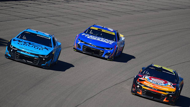 Ross Chastain (1) drives alongside Kyle Larson (5) and Shane Van Gisbergen (16) during the South Point 400.