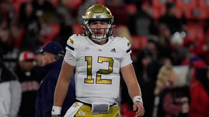 Georgia Tech quarterback Aaron Philo (12) warms up before the start of a NCAA college football game against Georgia in Athens, Ga., on Friday, Nov. 29, 2024. Philo played his high school football in the Athens area winning a state championship at Prince Avenue Christian.