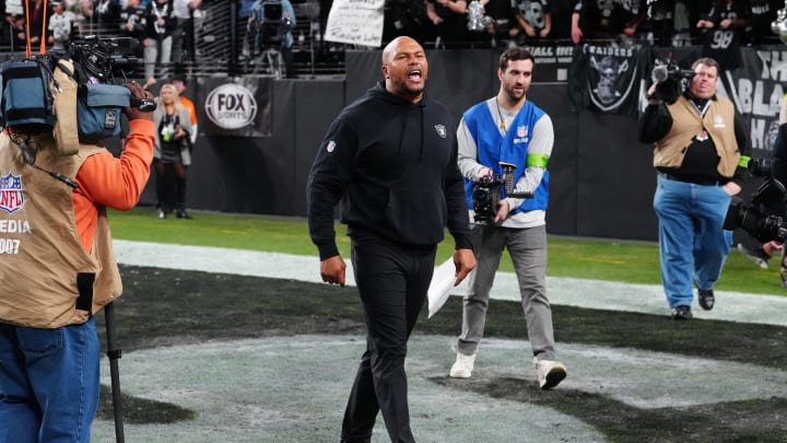 Jan 7, 2024; Paradise, Nevada, USA; Las Vegas Raiders interim head coach Antonio Pierce cheers with fans after the Raiders defeated the Denver Broncos 27-14 at Allegiant Stadium. Mandatory Credit: Stephen R. Sylvanie-USA TODAY Sports