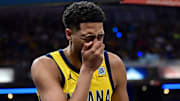 Oct 27, 2024; Indianapolis, Indiana, USA; Indiana Pacers guard Tyrese Haliburton (0) grabs his nose after being hit in the face during the first quarter against the Philadelphia 76ers at Gainbridge Fieldhouse. Mandatory Credit: Marc Lebryk-Imagn Images