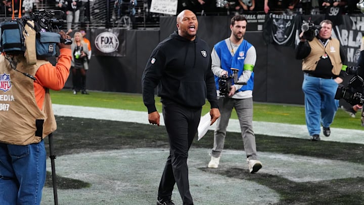 Jan 7, 2024; Paradise, Nevada, USA; Las Vegas Raiders interim head coach Antonio Pierce cheers with fans after the Raiders defeated the Denver Broncos 27-14 at Allegiant Stadium. Mandatory Credit: Stephen R. Sylvanie-Imagn Images