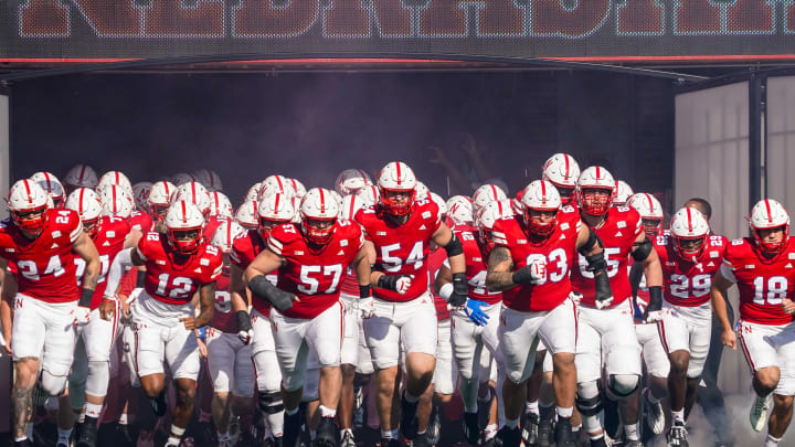 Oct 21, 2023; Lincoln, Nebraska, USA; The Nebraska Cornhuskers run onto the field before the game against the Northwestern Wildcats at Memorial Stadium. 