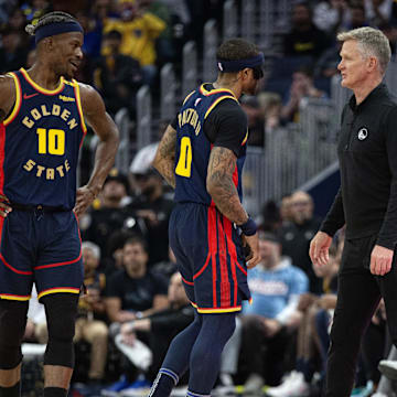 Mar 13, 2025; San Francisco, California, USA; Golden State Warriors head coach Steve Kerr (right) confers with players Jimmy Butler III (10) and Gary Payton II (0) during the second quarter at Chase Center. Mandatory Credit: D. Ross Cameron-Imagn Images