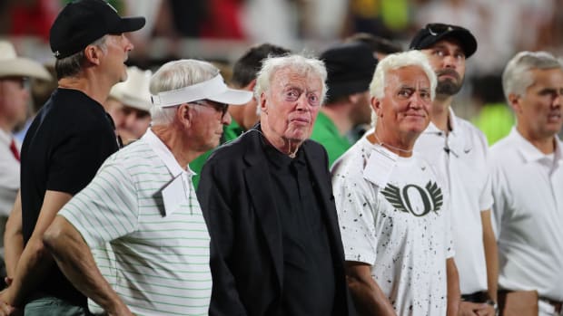 Phil Knight, co-founder and chairman of Nike on the sidelines in the second half