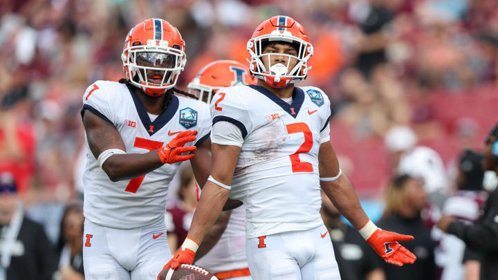 Jan 2, 2023; Tampa, FL, USA; Illinois Fighting Illini defensive back Matthew Bailey (2) celebrates after intercepting the ball in the end zone against the Mississippi State Bulldogs in the second quarter during the 2023 ReliaQuest Bowl at Raymond James Stadium. Mandatory Credit: Nathan Ray Seebeck-USA TODAY Sports