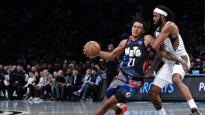 Apr 3, 2024; Brooklyn, New York, USA; Brooklyn Nets forward Noah Clowney (21) drives to the basket while being defended by Indiana Pacers forward Isaiah Jackson (22) during the third quarter at Barclays Center. Mandatory Credit: John Jones-USA TODAY Sports