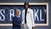 Jun 20, 2019; Brooklyn, NY, USA; Nicholas Claxton (Georgia) greets NBA deputy commissioner Mark Tatum after being selected as the number thirty-one overall pick to the Brooklyn Nets during the second round of the 2019 NBA Draft at Barclays Center. Mandatory Credit: Brad Penner-Imagn Images