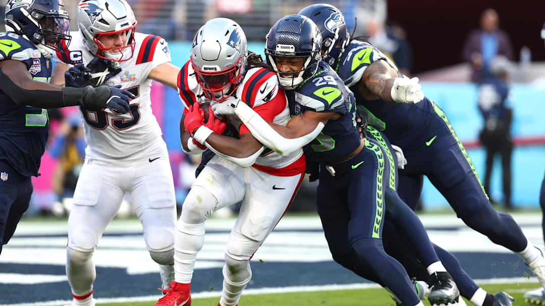 Feb 8, 2026; Santa Clara, CA, USA; Seattle Seahawks cornerback Josh Jobe (29) tackles New England Patriots running back Rhamondre Stevenson (38) during the second quarter in Super Bowl LX at Levi's Stadium. Mandatory Credit: Mark J. Rebilas-Imagn Images