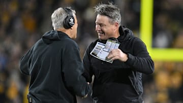 Nov 18, 2023; Iowa City, Iowa, USA; Iowa Hawkeyes head coach Kirk Ferentz (left) and assistant coach Brian Ferentz (right) react during the fourth quarter against the Illinois Fighting Illini at Kinnick Stadium. This was the last home game for Brian Ferentz who was told by the University of Iowa that he would not return next season.  Mandatory Credit: Jeffrey Becker-Imagn Images