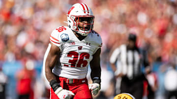 Jan 1, 2024; Tampa, FL, USA; Wisconsin Badgers linebacker Jake Chaney (36) reacts after a stop during the first half against the LSU Tigers at Raymond James Stadium. Mandatory Credit: Matt Pendleton-Imagn Images
