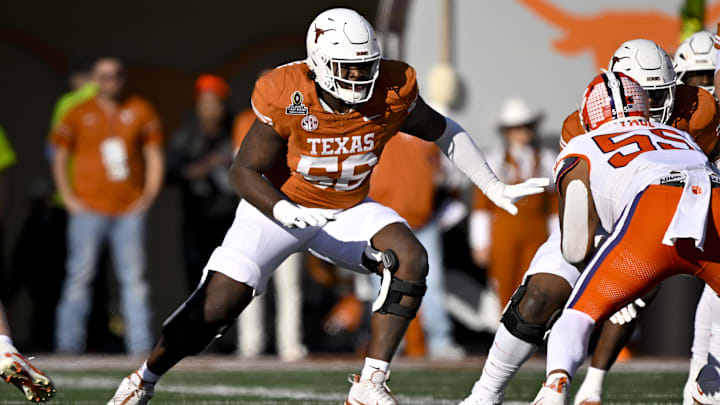 Dec 21, 2024; Austin, Texas, USA; Texas Longhorns offensive lineman Cameron Williams (56) in action during the game between the Texas Longhorns and the Clemson Tigers in the CFP National Playoff First Round at Darrell K Royal-Texas Memorial Stadium. Mandatory Credit: Jerome Miron-Imagn Images