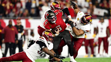 NFC Wild Card Playoffs: Tampa Bay Buccaneers QB Baker Mayfield ripped off an angry run and trucked All-Pro Bobby Wagner.